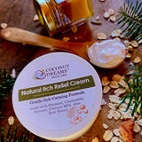 Coconut Dreams Skincare natural itch relief cream jar with oats, honey, and herbs.