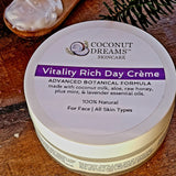 Coconut Dreams Skincare Vitality Rich Day Crème jar with mint and lavender label on wooden surface.