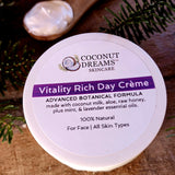 Vitality Rich Day Crème by Coconut Dreams Skincare shown from above with botanical accents.