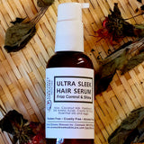 Coconut Dreams Skincare ultra sleek hair serum bottle on woven surface with dried botanicals.