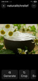 Bowl of white cream surrounded by chamomile flowers.